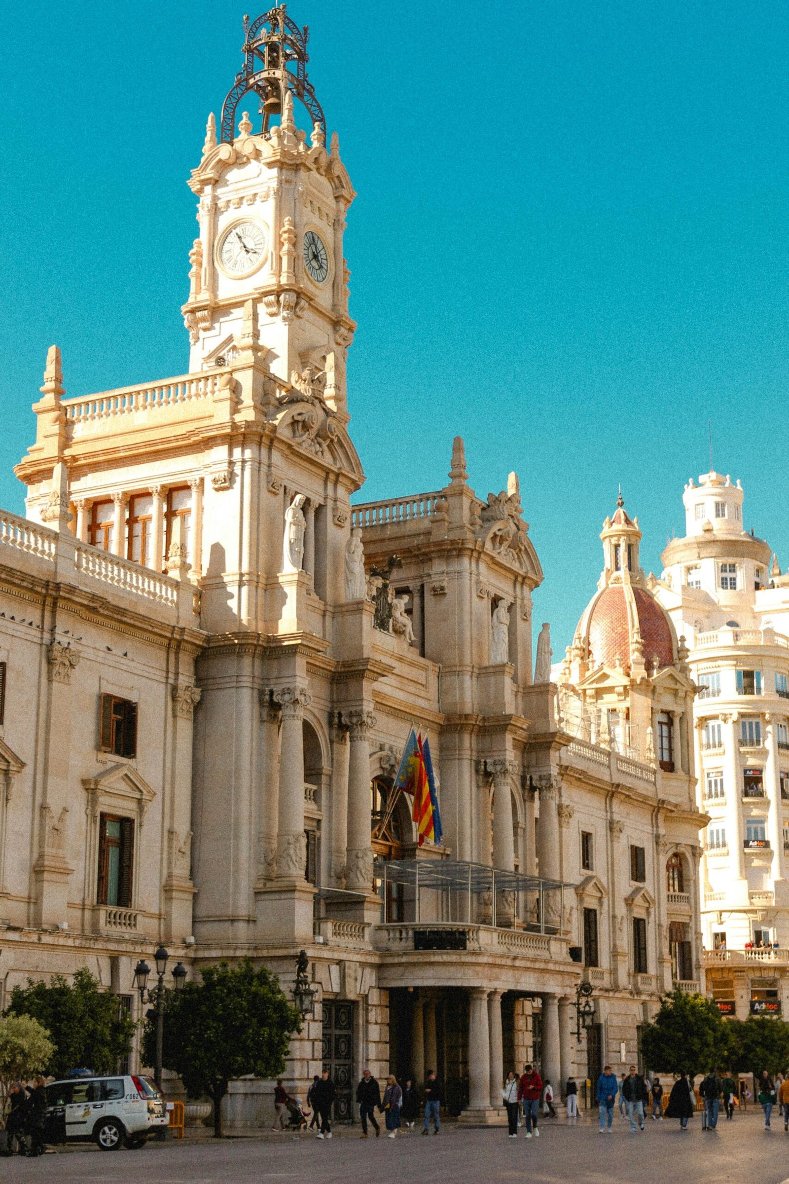 Stunning neoclassical architecture of Valencia Town Hall under a clear blue sky.